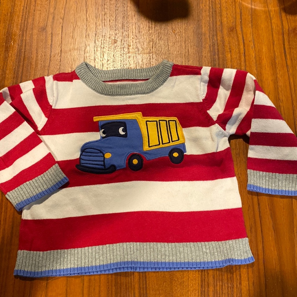 Used children’s place dump truck sweater size 9-12 M